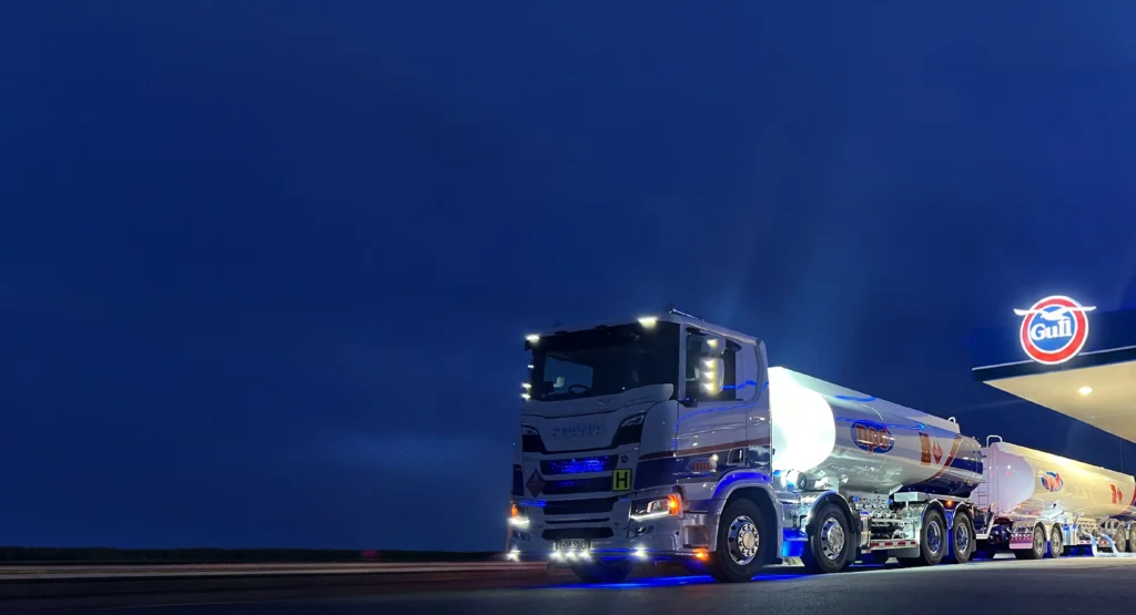 NPD fuel tanker at a Gull service station at night